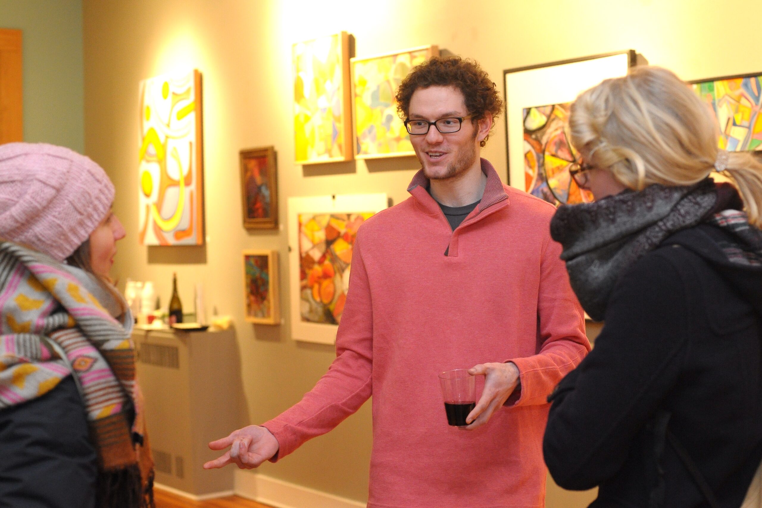Noah Glenn shooting the breeze with Emma Walesh and Brianna Haupt during Down Town Art Party in Some Sum Studio